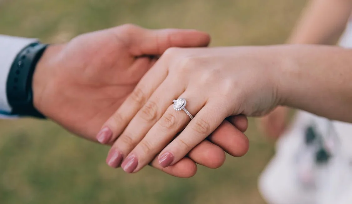A couple displaying a Lab Diamond Engagement Ring