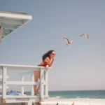 A Lifeguard watching over the beach from her post