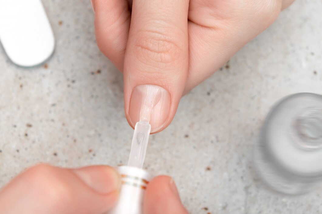 A girl using Builder gel to manicure her hands nail